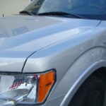 Before and after photographs of a damaged Ford pickup truck that was repaired by Elite Paint & Body Shop in West Palm Beach, Florida.